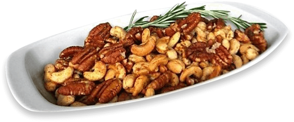 A white plate topped with nuts and rosemary.